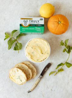 natural creamy butter being spread on bread