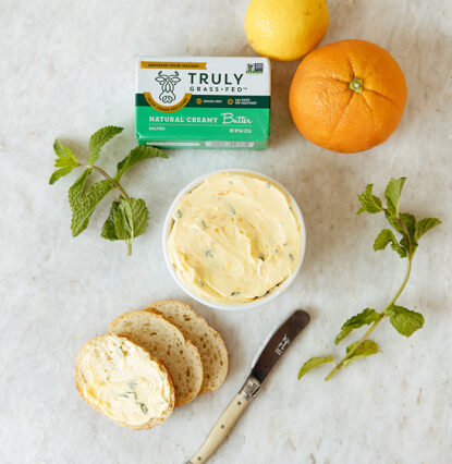 natural creamy butter being spread on bread