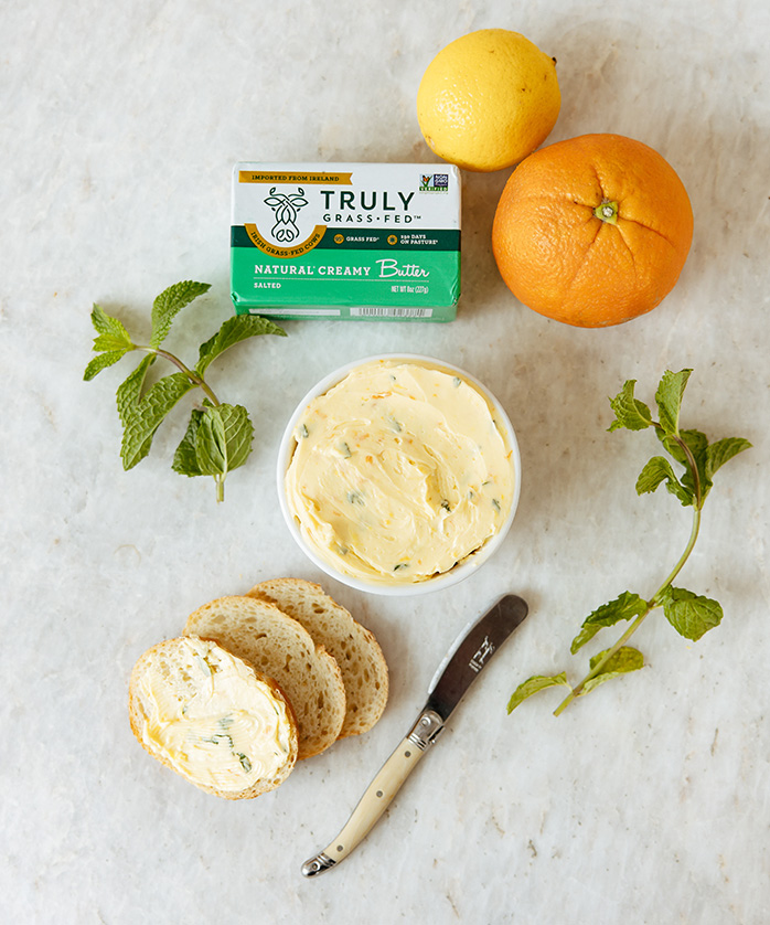 natural creamy butter being spread on bread