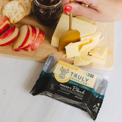 cheese board with truly grass fed makers blend cheddar wedge