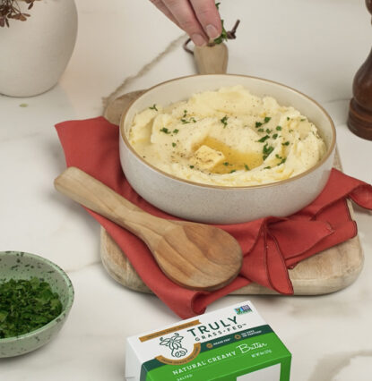 mashed potatoes in a bowl with butter melting