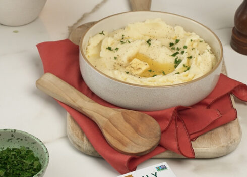 mashed potatoes in a bowl with butter melting