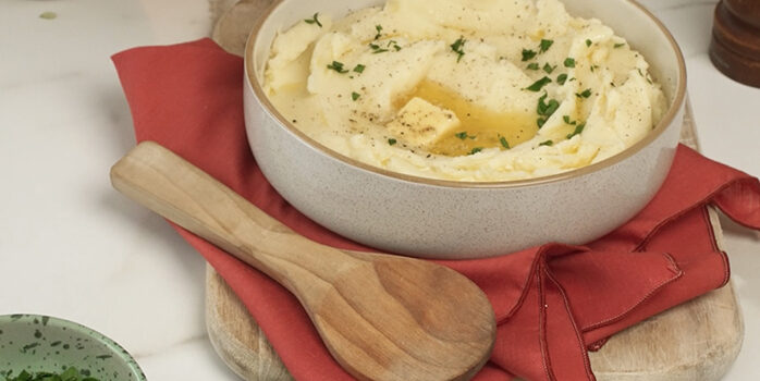 mashed potatoes in a bowl with butter melting