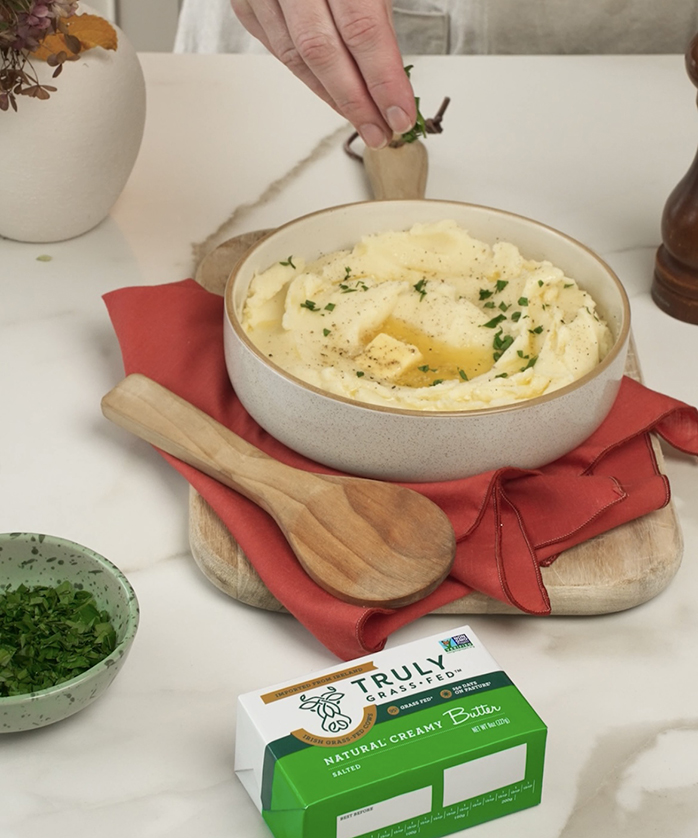 mashed potatoes in a bowl with butter melting